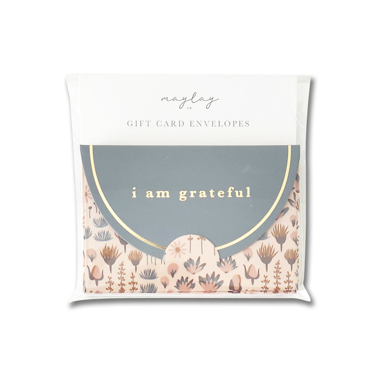 The "Sweetness Floral" 6 pack of gift card envelopes, from Maylay Co., features beautiful floral designs and the elegant gold foil inscription "i am grateful." These envelopes are crafted from matte finish paper, and their quality is highlighted by the transparent packaging that prominently displays the Maylay Co. brand at the top.