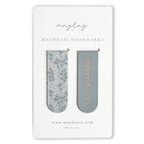 Eucalyptus Floral Magnetic Bookmarks by Maylay Co. offer the ideal companionship for your reading, featuring two stylish magnetic bookmarks on a card. The left bookmark showcases a blue floral pattern, while the right is solid blue with elegant gold text that reads "I am grateful." These thoughtful bookmarks by Maylay Co. ensure your page is marked beautifully and make for an excellent gift.