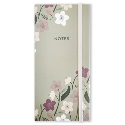 Introducing the Enchanted Garden Book of Sticky Notes by Maylay Co. – a charming green notebook adorned with "NOTES" on the cover, showcasing an intricate floral design featuring white, pink, and purple blooms. Its sophisticated stationery vibe is further elevated by a vertical elastic band along the right side. It pairs beautifully with your favorite floral sticky notes for an elegant touch.