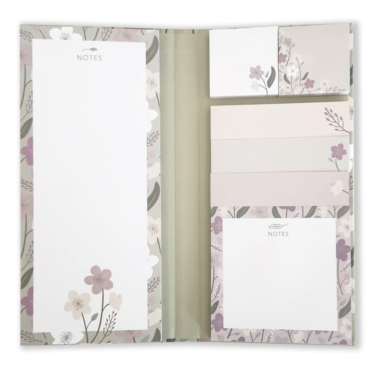 Introducing the Enchanted Garden Book of Sticky Notes by Maylay Co., a sophisticated stationery set featuring floral sticky notes in multiple sizes along with a notepad. The collection includes pastel-colored flowers and leaves, creating a delicate and decorative look ideal for any folio organizer.