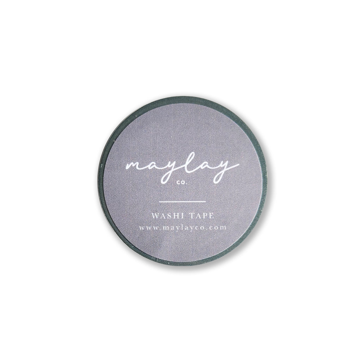 The "I Am Grateful Washi Tape - Sage Green" by Maylay Co. features a minimalist and sleek design, ideal for journaling or scrapbooking. It is a circular washi tape with a gray label where “maylay co.” is elegantly written in white cursive, along with “WASHI TAPE” and the website www.maylayco.com in smaller print.