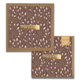 The Baby Blooms Gratitude Greeting Cards from Maylay Co. consist of two square cards with a brown background adorned with a white floral pattern. Each card features a gold strip displaying the words "I am grateful" in white text. A small label encourages you to pass on the gratitude, making these premium quality cards perfect for any occasion.