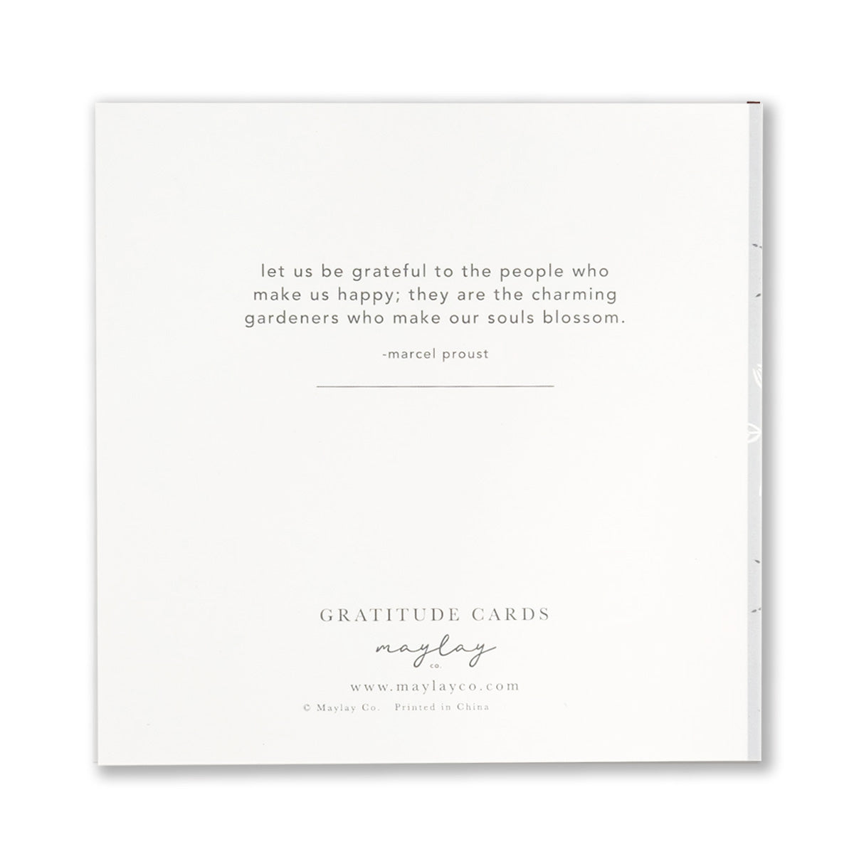 A white envelope featuring a quote by Marcel Proust: "Let us be grateful to the people who make us happy; they are the charming gardeners who make our souls blossom." It is elegantly packaged under Maylay Co.'s Misty Bloom Gratitude Greeting Cards, ideal for conveying sincere appreciation.