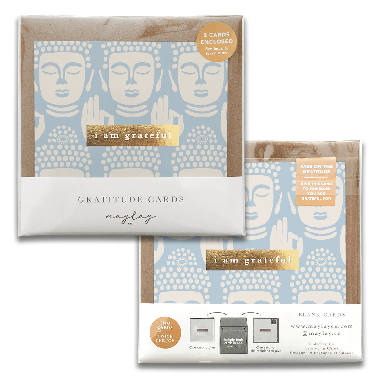 A pack of Be Still Gratitude Greeting Cards from Maylay Co. showcases a minimalist design with peaceful faces. The premium quality packaging holds two blank cards, highlighted by the message "I am grateful" with a golden accent.