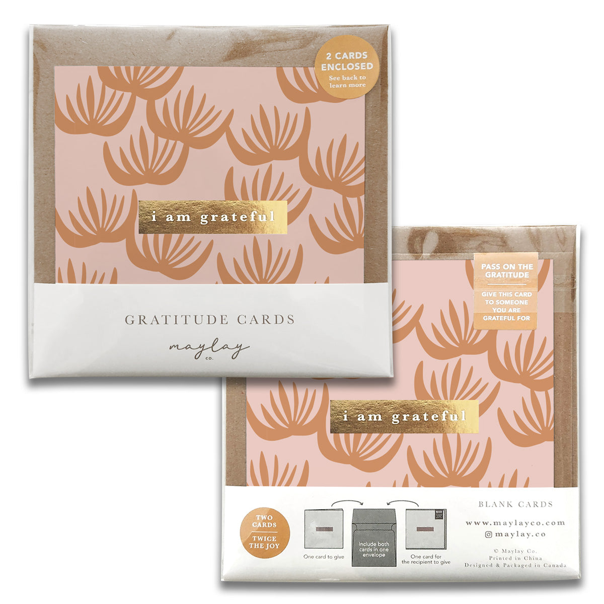 Two packs of Maylay Co.'s Block Print Floral Gratitude Greeting Cards, showcasing a pink and gold leaf motif. Each package, labeled "I am grateful," contains two greeting cards. The design includes instructions for gifting the card as a heartfelt expression of gratitude to someone special.