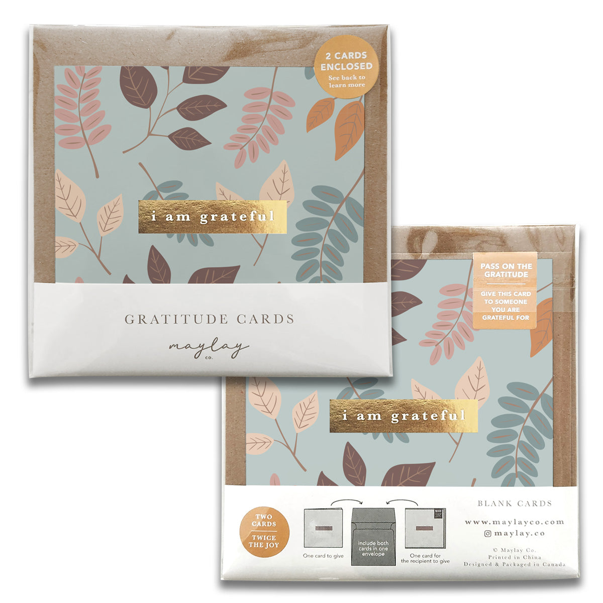 Two packs of Maylay Co.'s Falling Gratitude Greeting Cards, featuring a leaf design in shades of teal, brown, and beige, beautifully express your sentiments with the message "I am grateful." Each pack contains two blank thank you cards, making them perfect for heartfelt greetings.