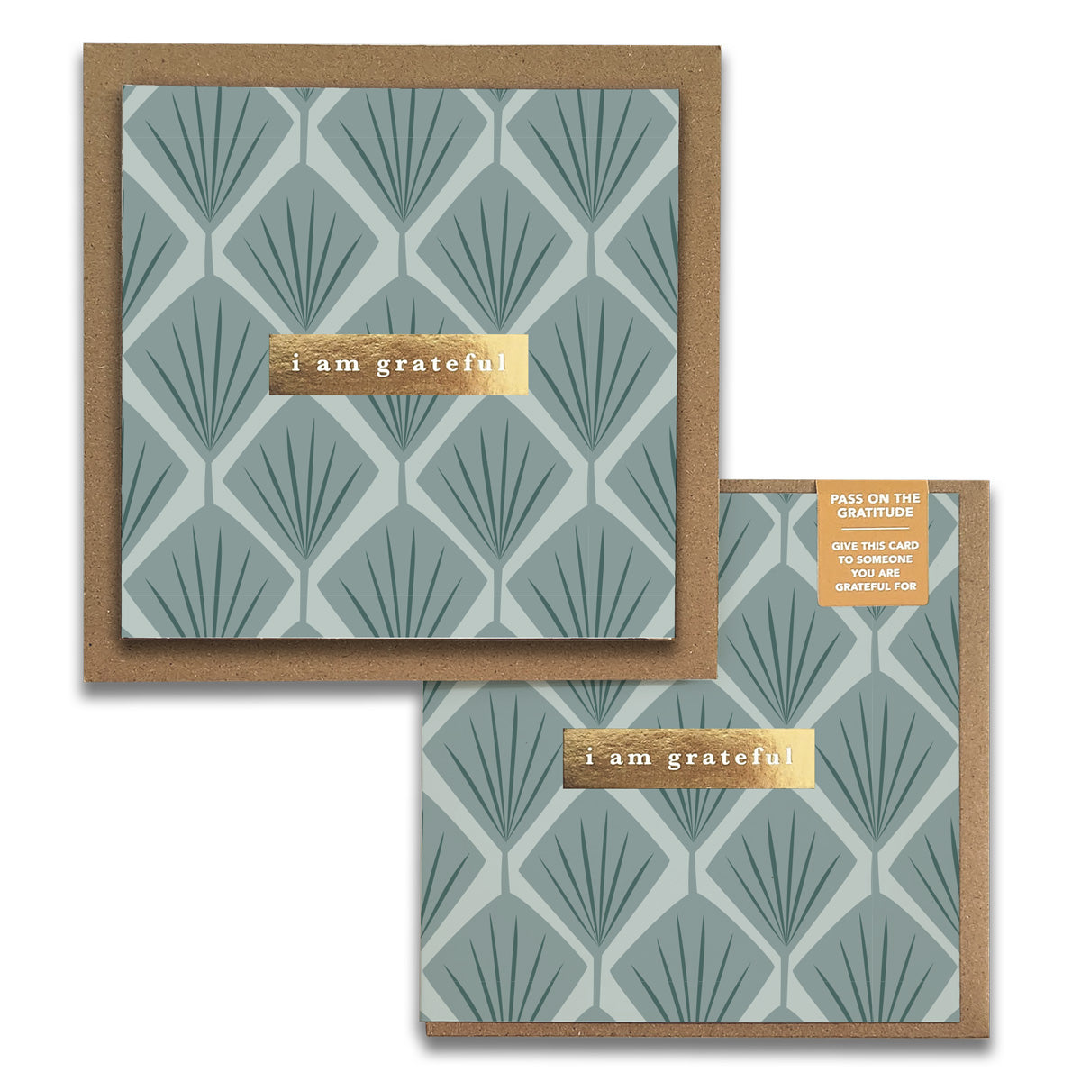 The Fans Floral Gratitude Greeting Card by Maylay Co. showcases a square design featuring a geometric leaf pattern in muted teal tones, crafted from premium materials. It includes a gold embossed label reading "I am grateful" at the center. A smaller version in the corner bears the tag "Pass on the Gratitude," making it ideal for expressing gratitude-inspired sentiments.