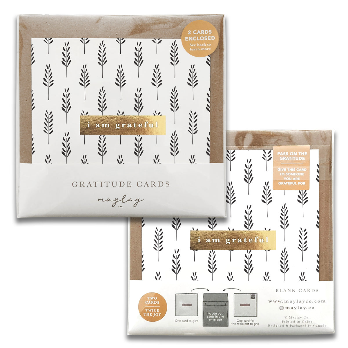 Two sets of Maylay Co.'s Field Monochrome Gratitude Greeting Cards, each featuring a minimalist design with black leaf patterns on a white background. Every set includes two gratitude cards adorned with the text "i am grateful." The packaging promotes sharing appreciation, making them ideal thank you notes.