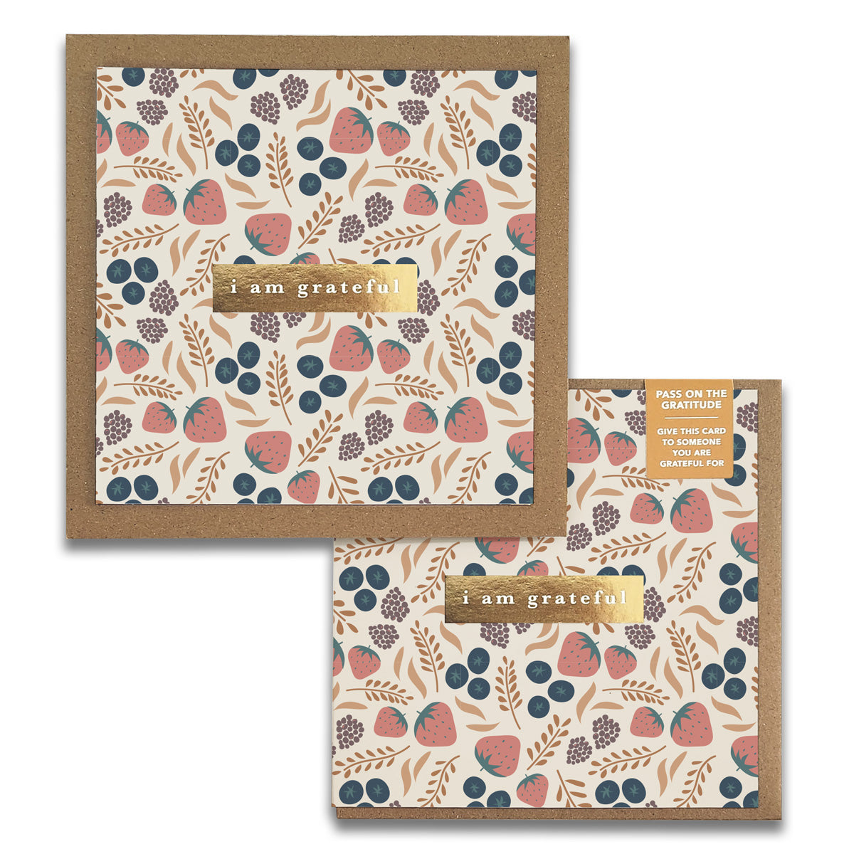 Discover the Fruity Gratitude Greeting Cards from Maylay Co., a set of two square cards adorned with botanical patterns that showcase delightful illustrations of strawberries, blueberries, and leaves. Each card elegantly features the phrase "I am grateful" in gold lettering, accompanied by a small note encouraging you to share your gratitude by passing the card along.