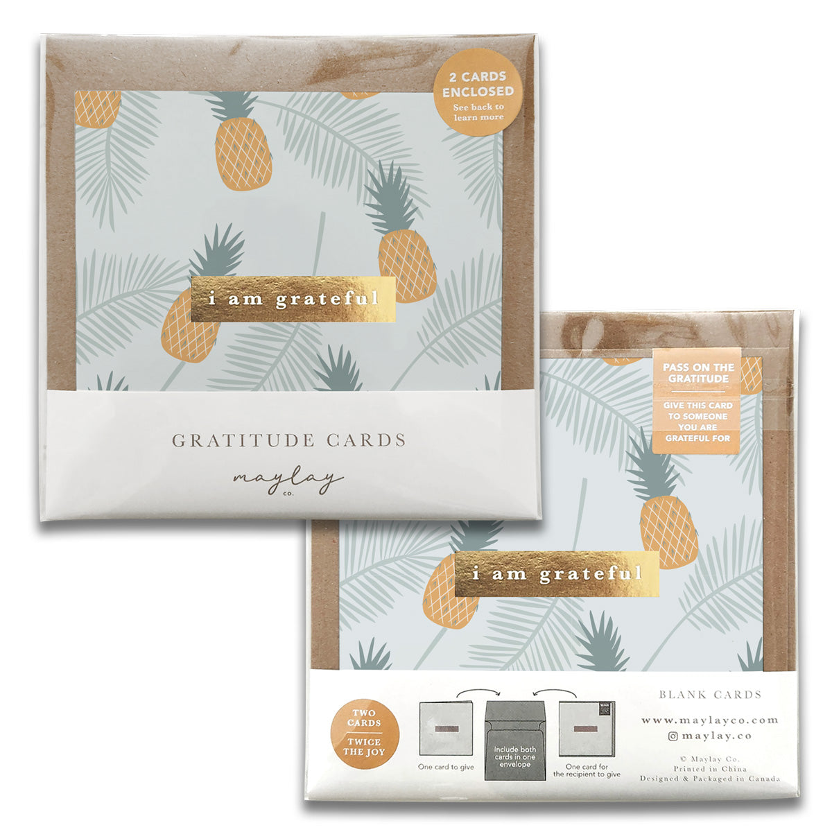 The Golden Gratitude Greeting Cards by Maylay Co. boast a charming design of yellow pineapples and green leaves set against a light blue background. Ideal for expressing gratitude, this package includes two blank greeting cards along with matching envelopes.