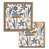 Introducing the Misty Bloom Gratitude Greeting Card by Maylay Co., a premium quality square card adorned with a beautiful floral design featuring blue, brown, and beige flowers and leaves. At its center is a chic brown label with the heartfelt message "I am grateful." Each card includes an orange tag encouraging you to "Pass on the gratitude: give this gratitude card to someone grateful for.