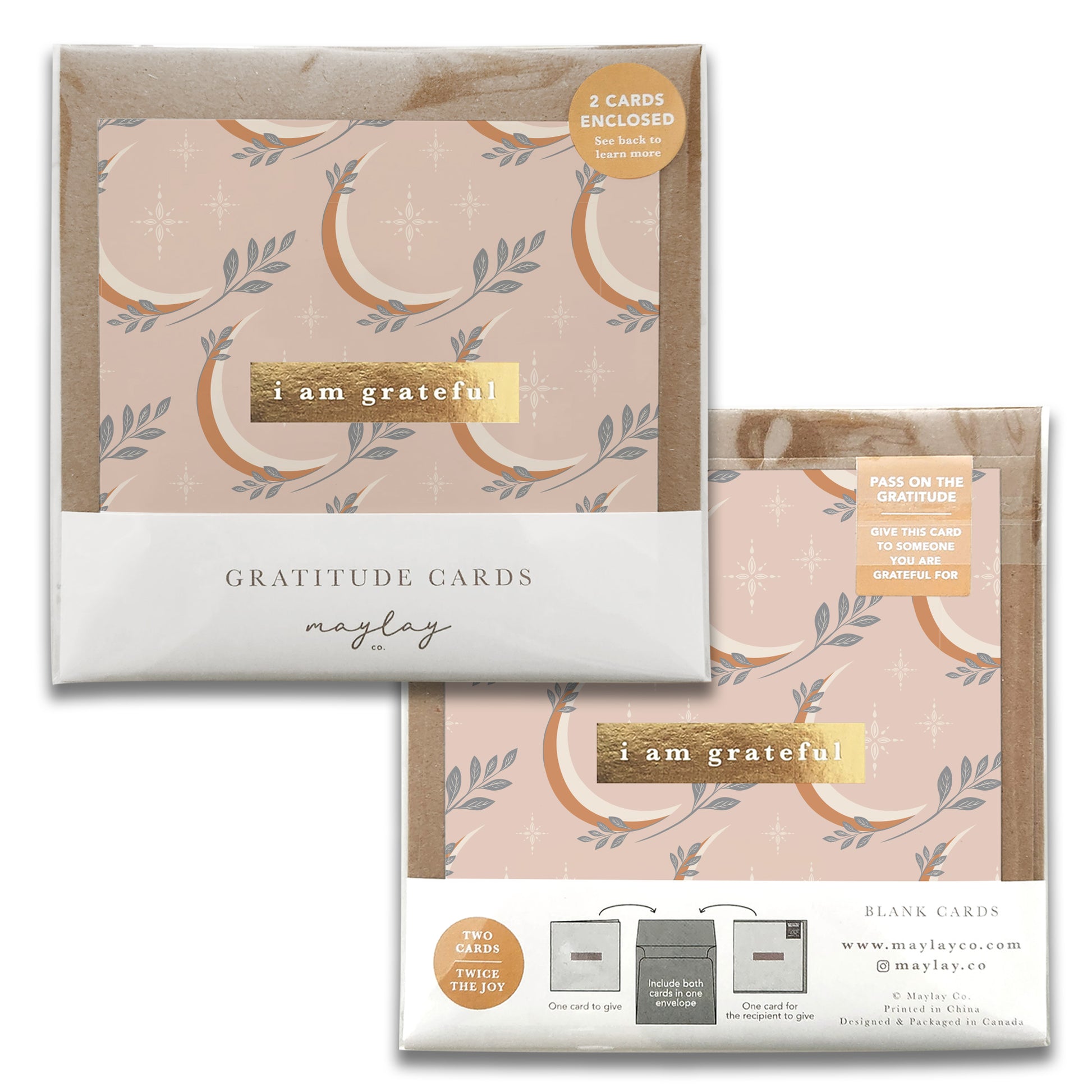 A set of two Moonrise Gratitude Greeting Cards by Maylay Co. showcasing an elegant pink and beige floral design with "I am grateful" inscribed in gold text on the front. Ideal for expressing thanks, the package comes with a website link and a motivational note encouraging the sharing of gratitude.