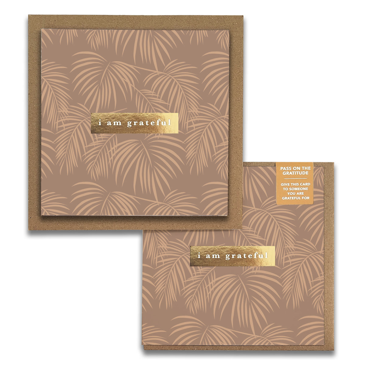 Introducing the Palms Leaves Gratitude Greeting Cards by Maylay Co. This stylish card features a square design with a brown background adorned with a delicate palm leaf pattern. The words "I am grateful" shimmer in gold foil on a label, adding an elegant touch. It comes with an additional smaller card of similar design, ideal for expressing heartfelt thanks.