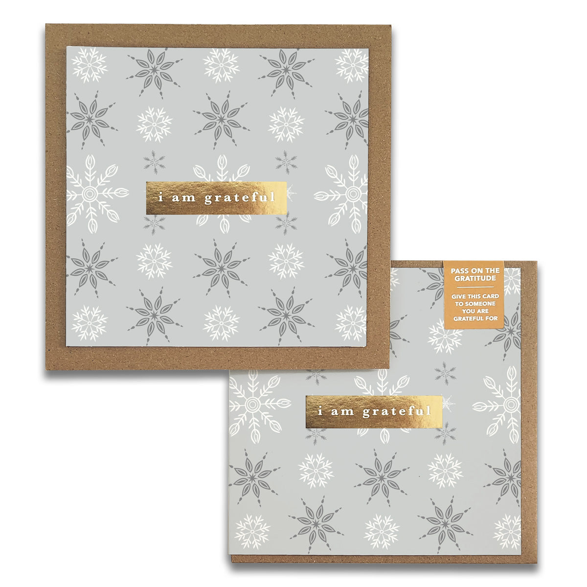 Maylay Co.'s Snowflakes Gratitude Greeting Cards include two stylish gratitude cards with a grey background embellished with delicate white snowflakes. Each card has a gold strip inscribed with "I am grateful" and comes with a touching note encouraging the recipient to spread the gratitude.