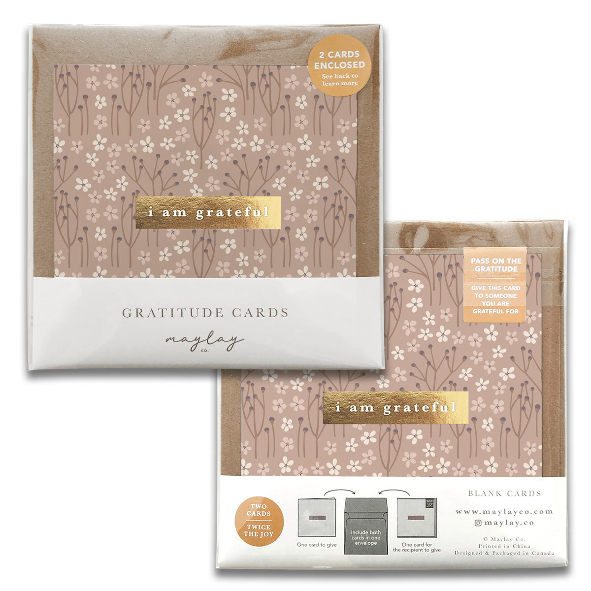 A set of Tranquility Gratitude Greeting Cards by Maylay Co., showcasing a floral design on a beige background. The front card is inscribed with "I am grateful," and the package contains two cards along with envelopes.