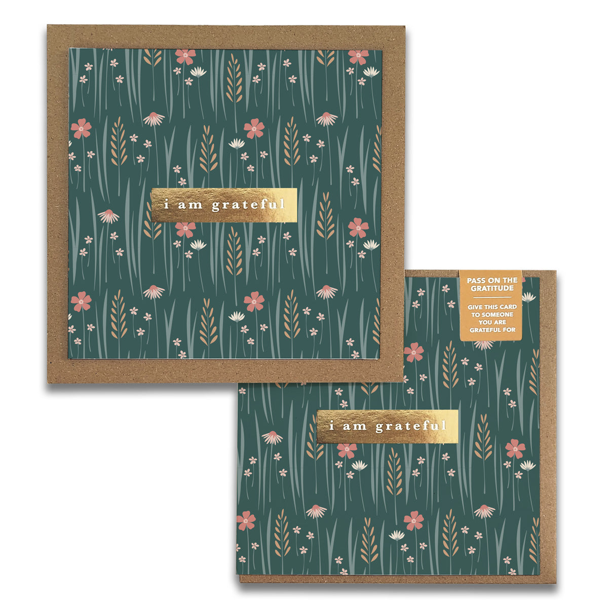 Two elegant Wildflowers Gratitude Greeting Cards from Maylay Co. feature a floral pattern on a green background. Each card displays the text "I am grateful" in the center and includes designs of pink and white flowers with green grass and leaves. A small label inspires sharing thanks with these thoughtful greeting cards.