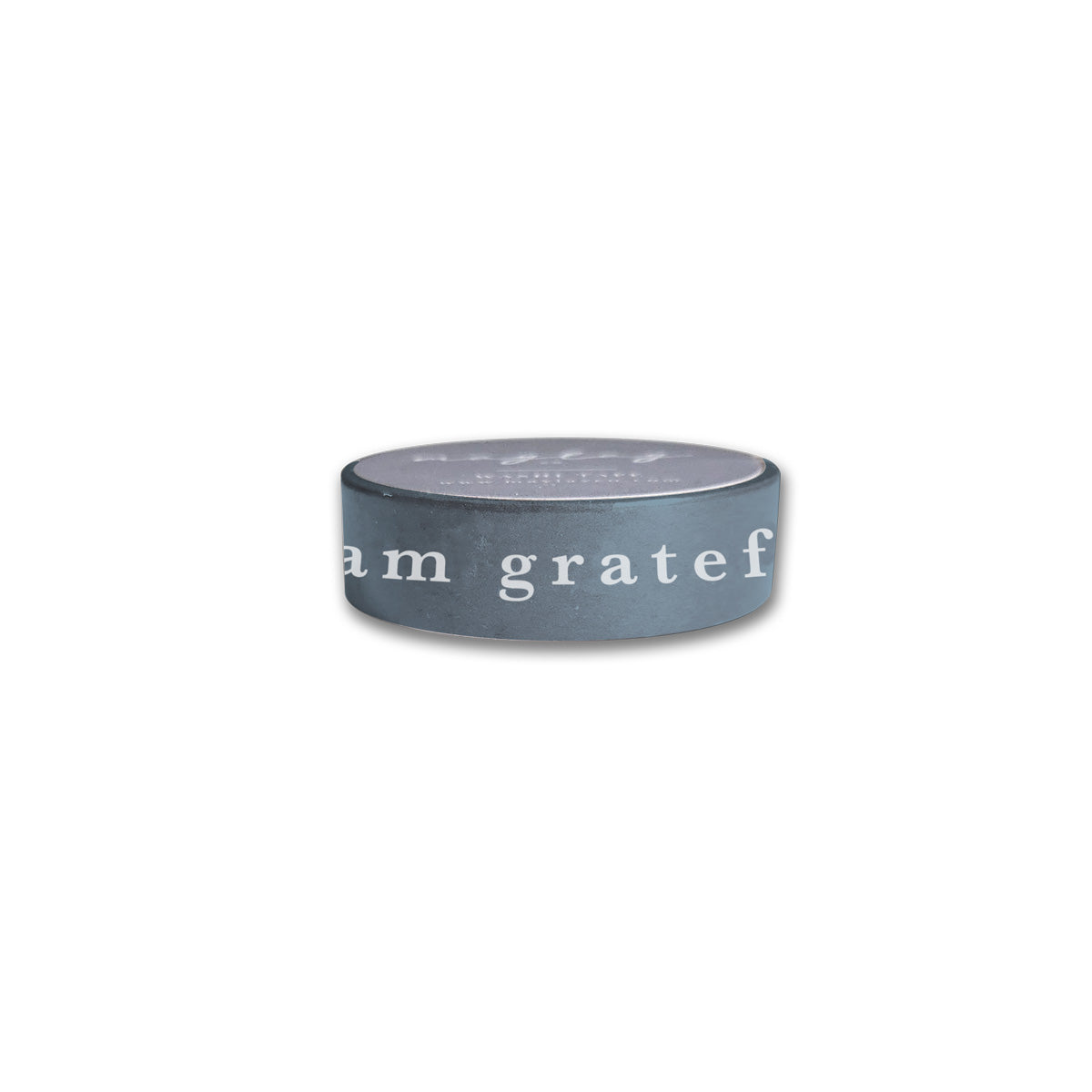 Introducing the I Am Grateful Washi Tape in slate blue by Maylay Co., this decorative tape is perfect for adding flair to your journaling space or complementing other decorative elements. Its minimalist design, featuring the words "I am grateful" in white on a sleek dark hue, stands out beautifully against a plain white background.