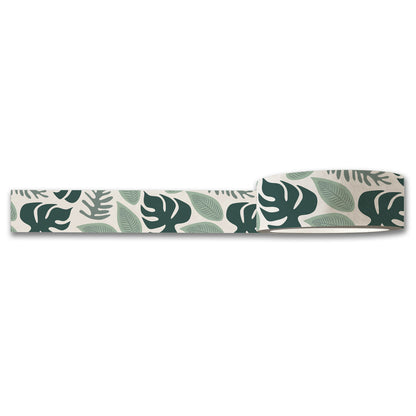 The Rainforest Washi Tape by Maylay Co. features a pattern of lush green tropical leaves on a crisp white background, showcasing various leaf shapes in vibrant shades of green. The intricate leaf print is perfectly highlighted as the tape is partially unrolled.