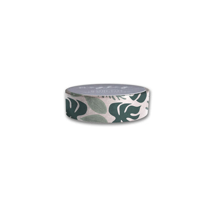 A roll of Rainforest Washi Tape from Maylay Co. showcases a white background embellished with green leaf patterns, featuring designs resembling monstera and other tropical foliage to add a fresh touch to any project.