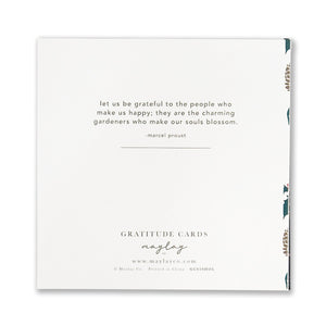 A Holiday Foli Gratitude Greeting Card from Maylay Co. showcases a gold foil stamp design on a white background, featuring a Marcel Proust quotation about appreciating those who bring us joy. The card is elegantly designed with a decorative border and includes Maylay Co.'s contact information at the bottom.