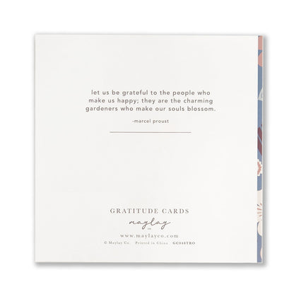 Introducing the Tropic Garden Gratitude Greeting Card by Maylay Co., from our exquisite Greeting Cards collection. This square card features a Marcel Proust quote: "Let us be grateful to the people who make us happy; they are the charming gardeners who make our souls blossom," beautifully framed by a subtle floral design on the edge.